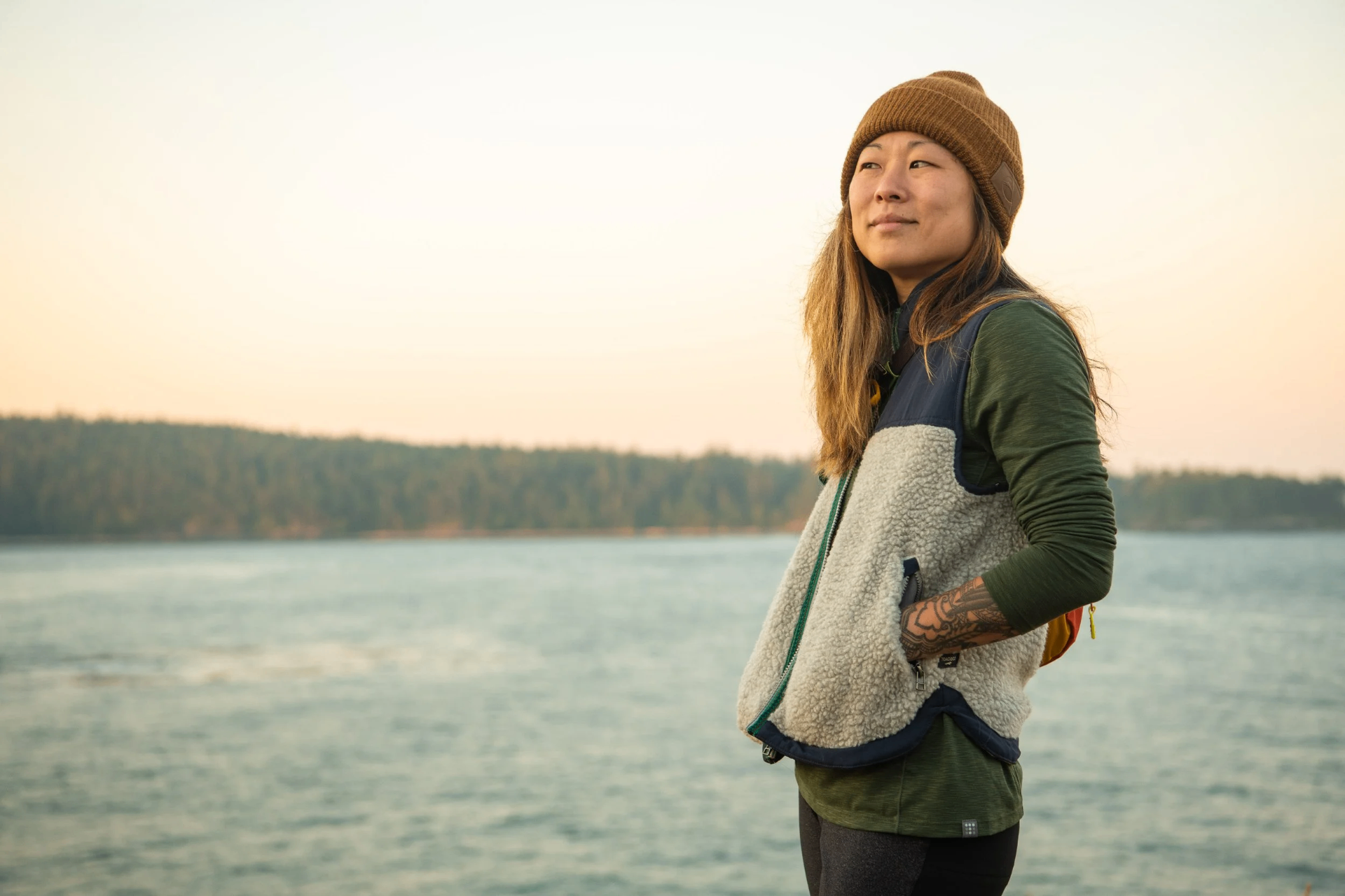 Molly Hawkins looking out over Puget Sound at golden hour