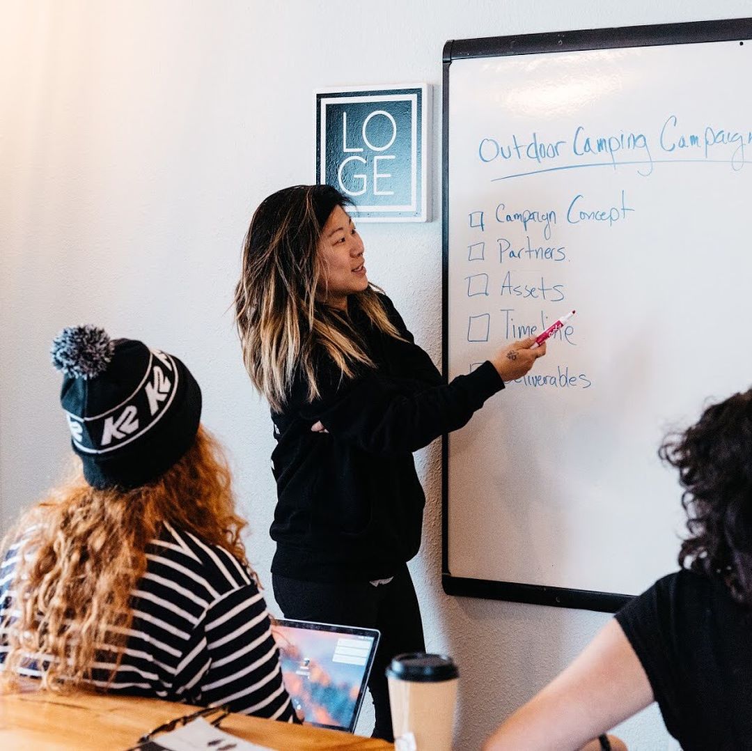 Molly Hawkins leading a campaign planning session at a whiteboard